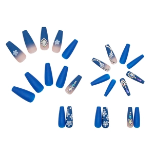 Blue matte press-on ballerina nails with gradient finish, white flowers and rhinestones