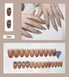 Detail of nude gradient press-on nails with sparkling square rhinestones set of 24 pieces
