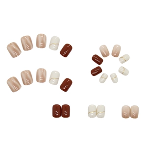 Short square press-on nails in nude gradient, chocolate brown, and cream with gold lines