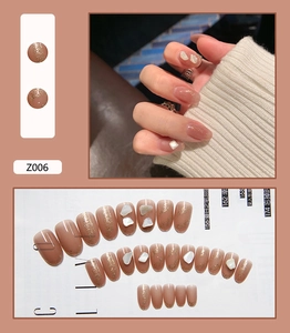 Short round nude pink press-on nails with gold foil glitter and shell pieces 24pcs