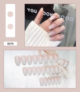 Close-up of 24pcs pink ombre gradient coffin press-on nails set with glossy finish