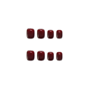 Short square burgundy press-on nails with silver glitter border and high-gloss finish