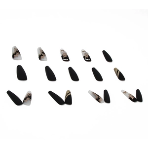Long ballet press-on nails with matte black, gold floral designs and pearl accents