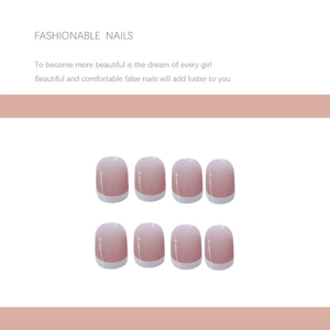 Detail of pink French tip press-on nails with oval shape and white gradient design