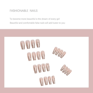 Starry nude pink coffin press-on nails with silver glitter and rhinestone accents