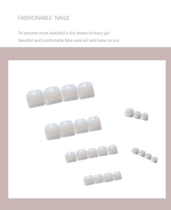 Classic white French tip toe press-on nails in nude pink base for summer pedicures
