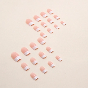 Classic french tip press-on nails with pink base and white round tips in a 24-piece set