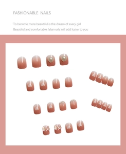 Detail of 24pcs pink gradient press-on nails with pearl hearts and 3D butterfly charms