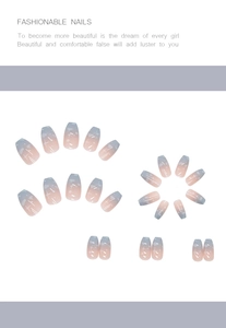 Close-up of blue and pink gradient coffin nails with star and dot decorations