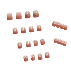 Pink gradient press-on nails with 3D butterfly, pearls, and heart decorations set