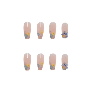 Pink gradient press-on nails with floral patterns and 3D butterfly charms, ballerina shape
