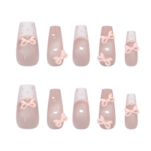 Faux ongles roses à presser style français avec nœuds et motif à pois dentelle