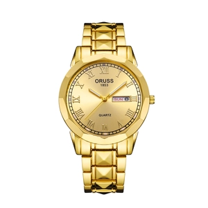 Close-up of gold men's watch dial with Roman numerals and day-date display