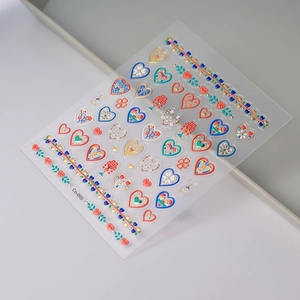 Detailed view of 5D embossed heart and floral nail stickers with golden textures