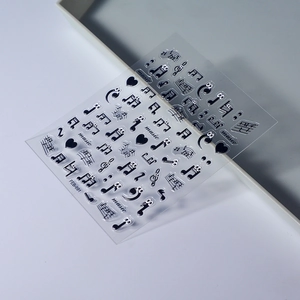 Black embossed music notes nail art stickers with treble clefs and heart patterns
