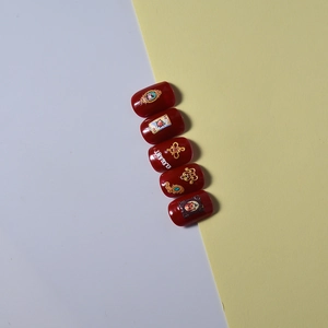 Vintage deep red embossed nail art stickers with gold frames and elegant patterns
