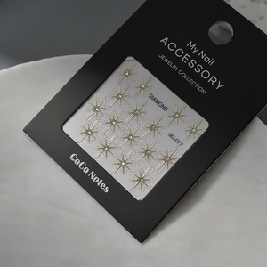 Sparkling gold star nail art stickers with inlaid rhinestones on professional card