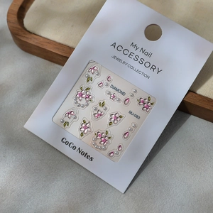 Exquisite pink cherry blossom nail art stickers with pearls and metallic gold leaves