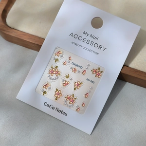 3D floral nail art stickers with pink cherry blossoms and pearls on white card