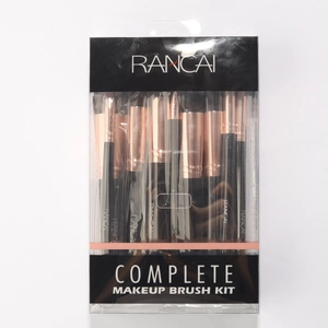 Detail of complete makeup brush kit with rose gold ferrules in professional packaging