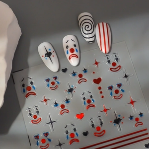 Cartoon clown circus nail art stickers with heart motifs and striped patterns on gray background