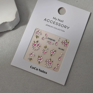 Pink cherry blossom nail stickers with pearls on professional display card