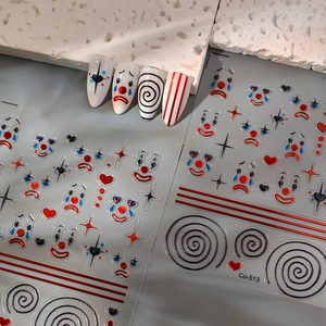 Clown circus nail art stickers with red, blue and black heart patterns on model nails