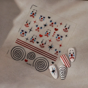 Macro detail of Co-513 circus clown nail decals with heart and star patterns