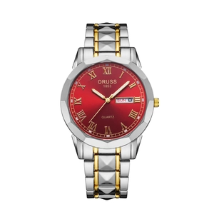 Detail of dark red sunray dial with golden Roman numerals and luminous hands on watch
