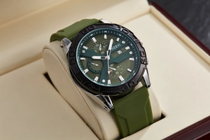 Detailed macro view of dark green dial with chronograph sub-dials and silicone strap