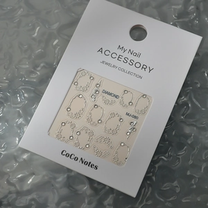 Detail view of Silver MJ-080 nail stickers with floral patterns and diamond accents