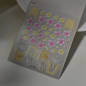 Macro view of 3D pink cherry blossom nail stickers with golden wave textures