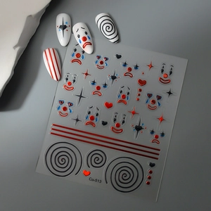Detail view of circus clown nail decals Co-513 with red and blue star patterns