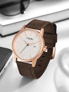 Detailed side view of a minimalist white dial watch with date display and brown strap