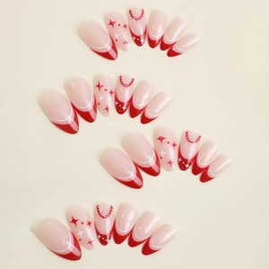 Christmas press-on nails set featuring red French tips and star patterns for women