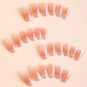 Pink gradient press-on nails with silver glitter tips in an oval shape, multi-size set