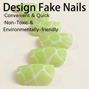 Green giraffe pattern press-on nails with matte texture and minimalist sweet design style