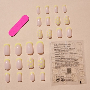Yellow French heart print press-on nail kit with 24 nail pieces and adhesive stickers