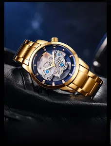 Detail view of the golden skeleton dial and intricate mechanical gear structure of the watch