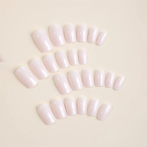 Minimalist solid soft pink press-on nails set in short square shape with glossy finish