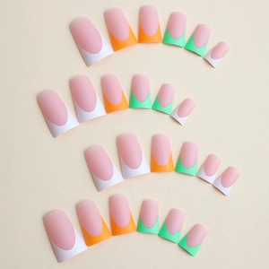 Matte press-on nails with colorful French tips in neon orange, green and white