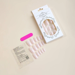 Soft pink press-on nail kit featuring square nails, nail file, and adhesive jelly glue