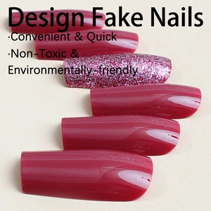 Glossy burgundy and glittery purple long coffin press-on nails on a pale yellow background