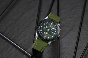 Detail of army green silicone strap and multifunctional chronograph dial on men's sport watch