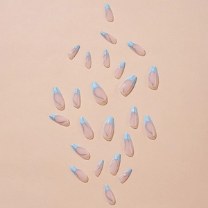Blue French tip almond press-on nails with silver glitter waves on pink background