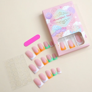 Macro shot of French macaron colored duckbill press-on nails with file and glue tabs