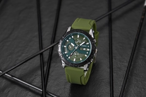 Detailed close-up of army green tactical watch dial with chronograph sub-dials and date window