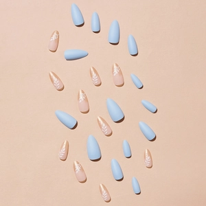 Golden French almond press-on nails in blue and pink tones with white leaf patterns