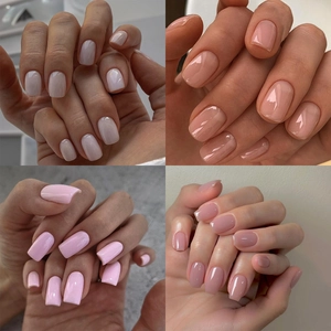 Detailed close-up showing four elegant glossy press-on nail styles in nude and pink tones
