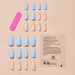 French almond press-on nail kit with light blue matte and leaf pattern designs